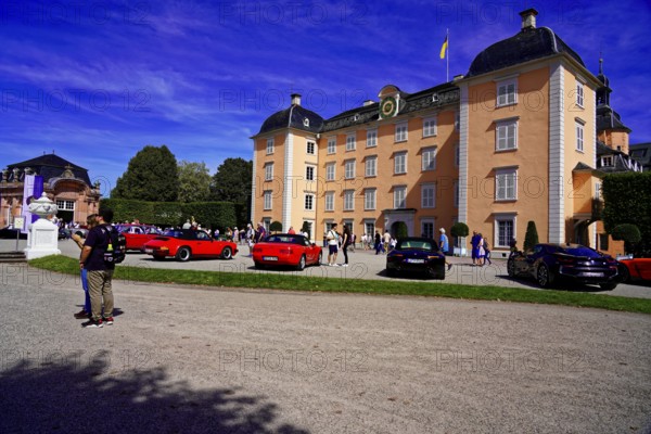 Oldtimer Classic, Gala International Concours d'Elegance Schwetzingen 2025, Germany, Europe, A castle with modern and classic cars in front of it and a cloudless sky