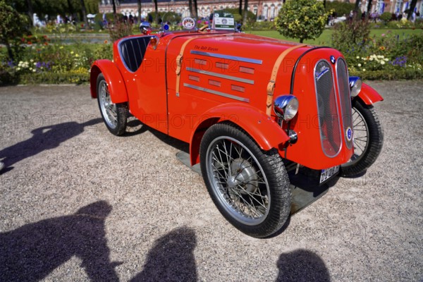 BMW DIXI, Year of manufacture 1928, Classic vintage car, Gala International Concours d'Elegance Schwetzingen 2025, Germany, Europe, Bright red vintage racing sports car at a sunny exhibition