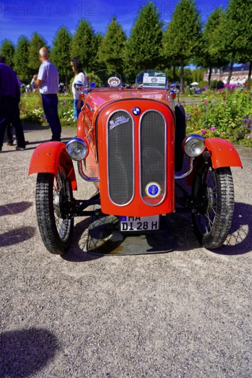 BMW DIXI, year of construction 1928, Oldtimer Classic, Gala International Concours d'Elegance Schwetzingen 2025, Germany, Europe, Frontal view of a bright red racing car at a classic car exhibition