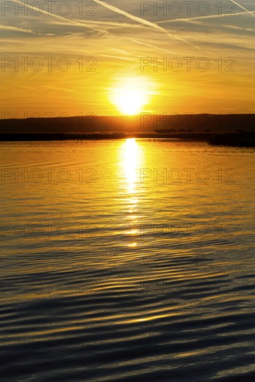 Lake Neusiedl, Burgenland, Austria, Europe, A magnificent sunset is reflected in the calm waters, Sailing boats on Lake Neusiedl