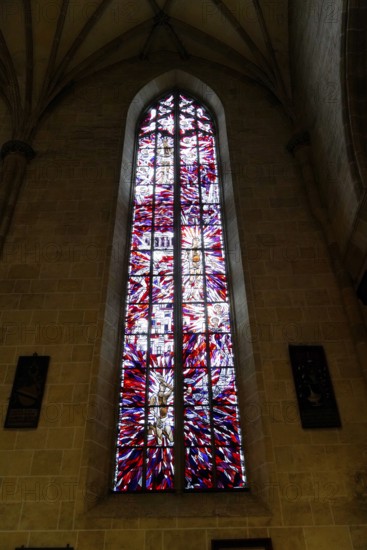The interior of the largest Protestant church in Germany. It has the world's highest church tower, Ulm Minster, Germany, Europe, Large church window with colourful stained glass in Gothic architecture, Ulm