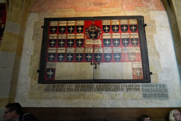 The interior of the largest Protestant church in Germany. It has the world's highest church tower, Ulm Minster, Germany, Europe, Historical plaque with coat of arms and text on a church wall, Ulm