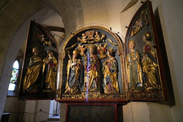 The interior of the largest Protestant church in Germany. It has the world's highest church tower, Ulm Minster, Germany, Europe, Magnificent altar with gilded sacred statues in a church, Ulm