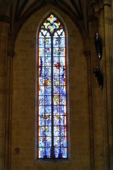 The interior of the largest Protestant church in Germany. It has the world's highest church tower, Ulm Minster, Germany, Europe, High, beautiful stained glass window in the cathedral with a lively play of colours and artistic details, Ulm