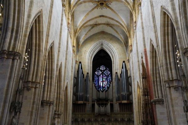 The interior of the largest Protestant church in Germany. It has the world's highest church tower, Ulm Minster, Germany, Europe, Majestic nave of a cathedral with a large organ and impressive stained glass window, Ulm
