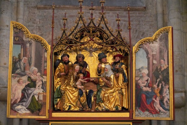 The interior of the largest Protestant church in Germany. It has the world's highest church tower, Ulm Minster, Germany, Europe, Richly decorated altar with golden figures and paintings in a church, Ulm