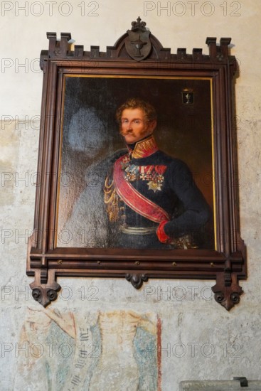 The interior of the largest Protestant church in Germany. It has the world's highest church tower, Ulm Minster, Germany, Europe, Portrait of a man in historical uniform in a decorative frame, Ulm