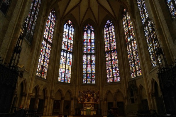 The interior of the largest Protestant church in Germany. It has the world's tallest church tower, Ulm Minster, Germany, Europe, Gothic church interior with large stained glass windows and an altar, Ulm