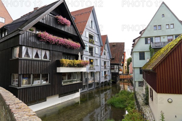 The picturesque fishermen's quarter in Ulm with its beautiful half-timbered houses on the Blau river, Colourful houses with half-timbered facades along a narrow watercourse, Ulm, Germany