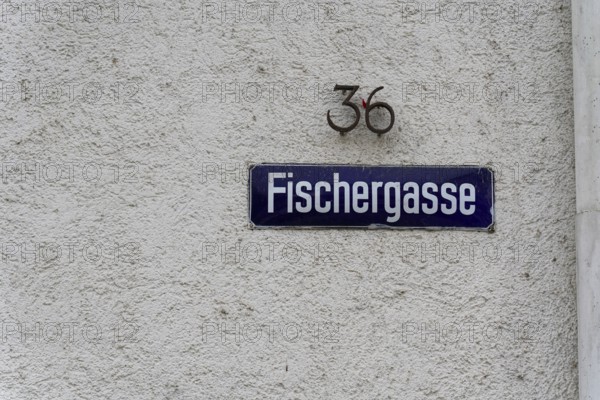 The picturesque fishermen's quarter in Ulm with its beautiful half-timbered houses on the Blau river, alleyway sign 'Fischergasse' with house number on a white wall, Ulm, Germany
