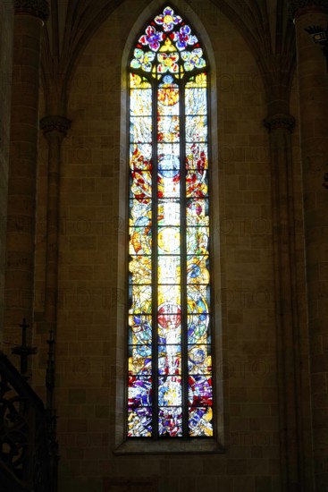 The interior of the largest Protestant church in Germany. It has the world's highest church tower, Ulm Minster, Germany, Europe, Towering, colourful stained glass window with detailed depictions, Ulm