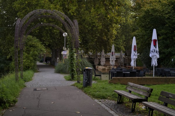 Beer garden on the Neckar, Neckar beer garden, empty, closed, Dinkelacker logo, Bad Cannstatt, Stuttgart, Baden-Württemberg, Germany
