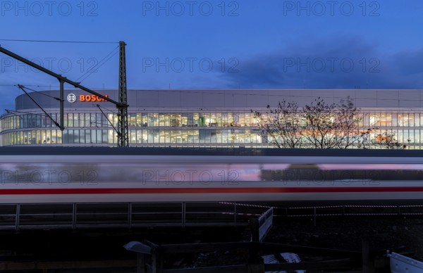 Office building of Bosch GmbH in Feuerbach. Bosch Digital, Bosch IT-Campus, building 701, in front of a passing ICE train of Deutsche Bahn AG. Stuttgart, Baden-Württemberg, Germany