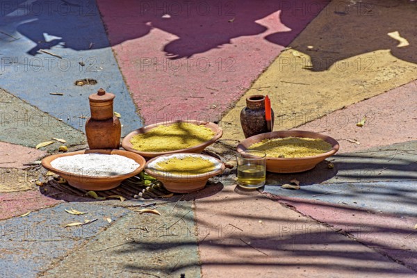 Food on a clay plate being offered to Exu in an Umbanda and Candomble party