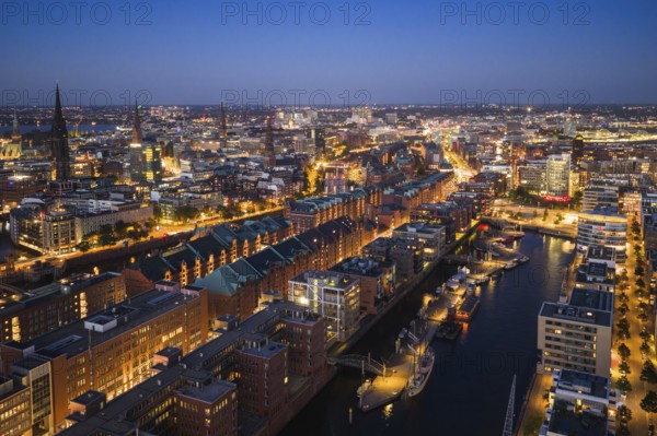 Aerial view of the historic warehouse district of Hamburg and Sandtor harbour at blue hour, Hamburg, Germany