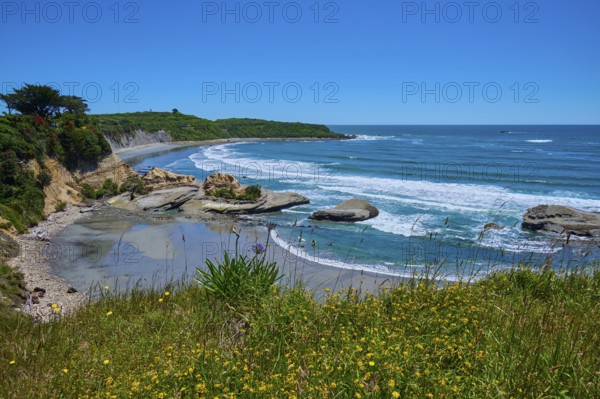 Coastal landscape with waves, rocks and blue sky, Cape Foulwind, West Coast, South Island, New Zealand