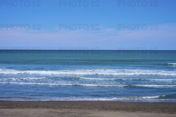 Calm beach with gentle waves on the blue horizon, Mana Bay, Patea, Taranaki, North Island, New Zealand