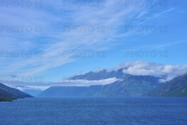 Tranquil landscape with mountains, blue lake and slightly cloudy sky, Drift Bay, Lake Wakatipu, Queenstown-Lakes District, Otago, South Island, New Zealand