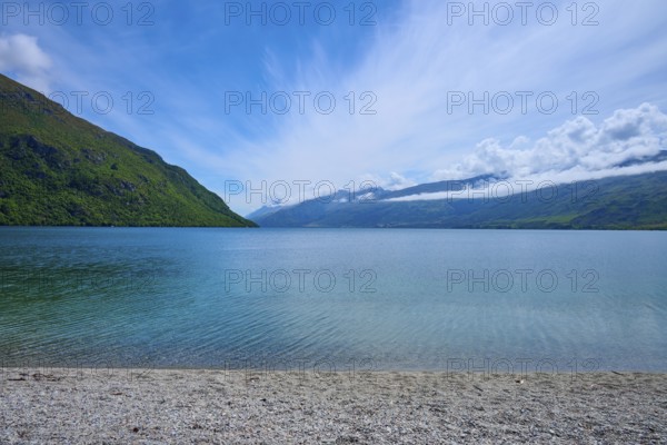 Peaceful beach landscape with blue sky and calm water, Kingston, Queenstown-Lakes District, Otago, South Island, New Zealand