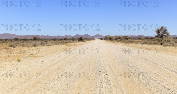 Abandoned area with dusty dirt road in Namibia