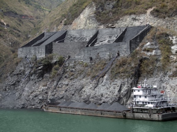 Chinese cargo ship and gravel distribution at yangtze river