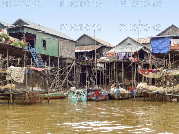 Traditional settlement with wooden houses at the Tonle Sap river in Cambodia