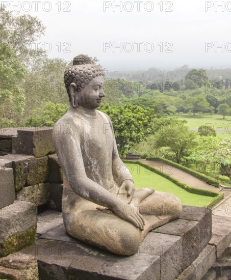 Buddha sculpture at a temple named Borobudur located in Java, a island of Indonesia
