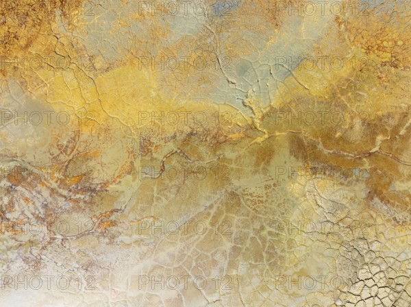 Abstract patterns in a waste pond in the mineral-rich area of the Rio Tinto mines. The colour is caused by oxidised iron minerals. Aerial view. Drone shot. Huelva province, Andalusia, Spain