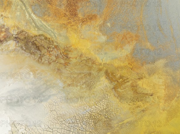 Abstract patterns in a waste pond in the mineral-rich area of the Rio Tinto mines. The colour is caused by oxidised iron minerals. Aerial view. Drone shot. Huelva province, Andalusia, Spain