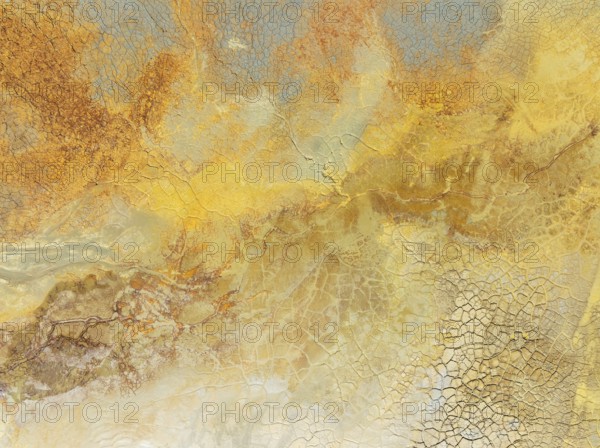 Abstract patterns in a waste pond in the mineral-rich area of the Rio Tinto mines. The colour is caused by oxidised iron minerals. Aerial view. Drone shot. Huelva province, Andalusia, Spain