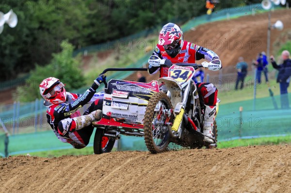 Motocross, Rudersberg, Baden-Württemberg, Germany, Europe, Double team on a motorbike rides over a steep section of the race track, Rudersberg motocross