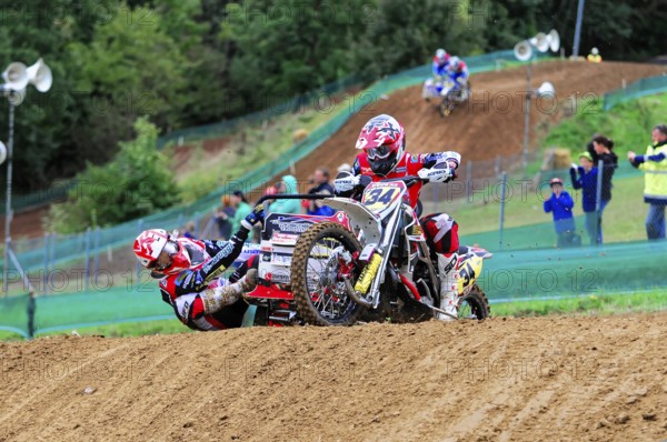 Motocross, Rudersberg, Baden-Württemberg, Germany, Europe, A motorbike rider with passenger rides through a judged course at full speed, Rudersberg motocross
