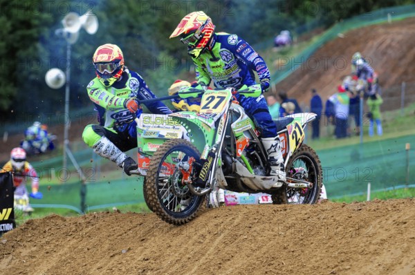 Motocross, Rudersberg, Baden-Württemberg, Germany, Europe, Two riders on a motorbike master a bend in a fast-paced race, Rudersberg Motocross
