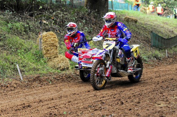 Motocross, Rudersberg, Baden-Württemberg, Germany, Europe, sidecar motorcyclist in a bend near straw bales on a muddy race track, Rudersberg motocross