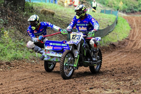 Motocross, Rudersberg, Baden-Württemberg, Germany, Europe, Rider on a sidecar motorbike manoeuvring through a narrow, muddy track, Rudersberg Motocross