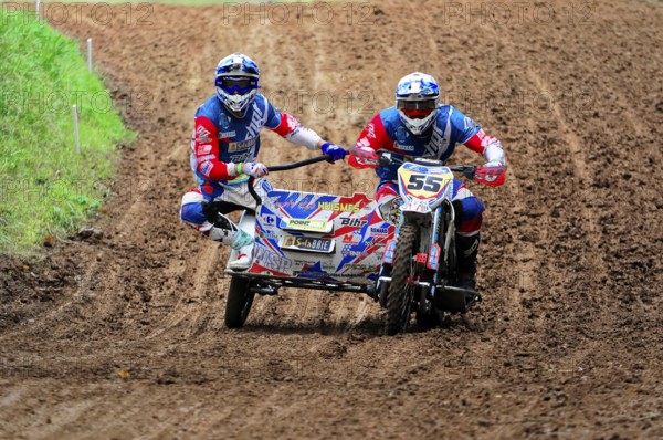 Motocross, Rudersberg, Baden-Württemberg, Germany, Europe, Sidecar motocross team manoeuvres through a muddy race track, Rudersberg motocross
