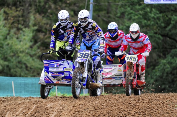 Motocross, Rudersberg, Baden-Württemberg, Germany, Europe, Two teams of motorcyclists riding over uneven ground during a race, Rudersberg motocross