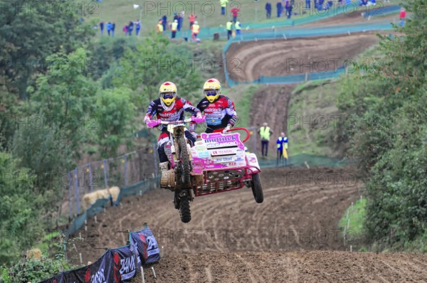 Motocross, Rudersberg, Baden-Württemberg, Germany, Europe, motocross team with sidecar takes off over a hilly track in front of spectators, Rudersberg motocross