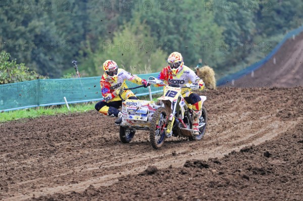 Motocross, Rudersberg, Baden-Württemberg, Germany, Europe, Motocross rider with sidecar at full speed on a muddy track, Rudersberg motocross