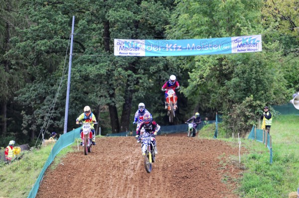 Motocross, Rudersberg, Baden-Württemberg, Germany, Europe, Several riders on motorbikes at a motocross competition on a muddy track, Rudersberg motocross