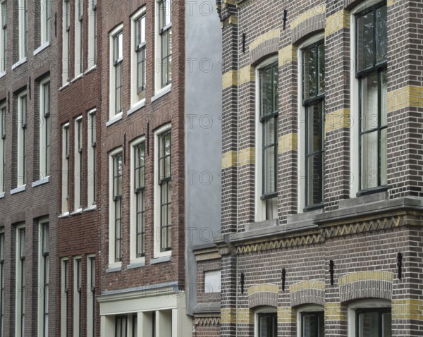 Detail of some house facades seen in Amsterdam (Netherlands)