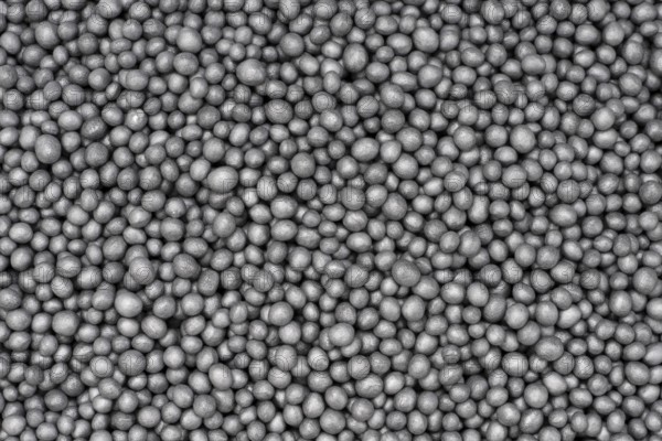 Full frame closeup showing lots of dark polystyrene beadlets