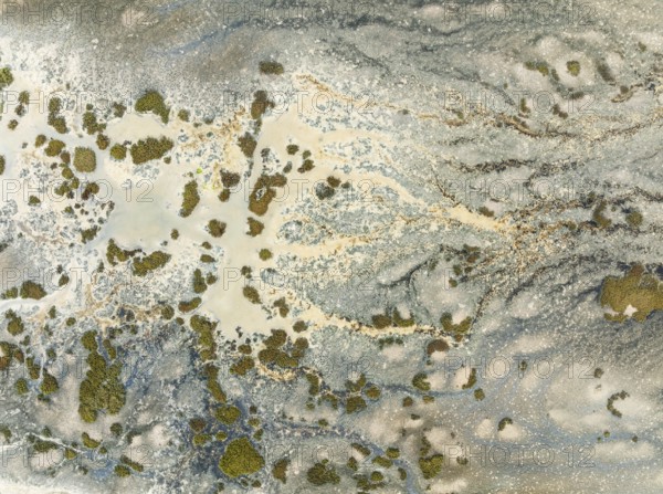 Marshland at low tide. Nature Reserve La Breña y Marismas del Barbate. Aerial view. Drone shot. Cádiz province, Andalusia, Spain