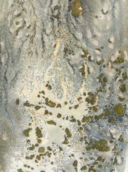 Marshland at low tide. Nature Reserve La Breña y Marismas del Barbate. Aerial view. Drone shot. Cádiz province, Andalusia, Spain