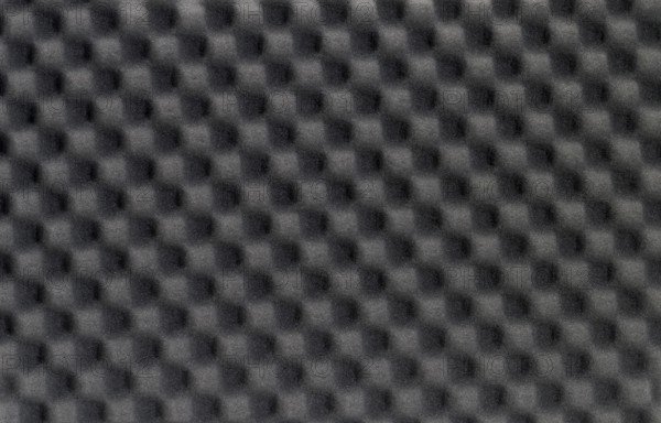 Full frame background of black foam plastics