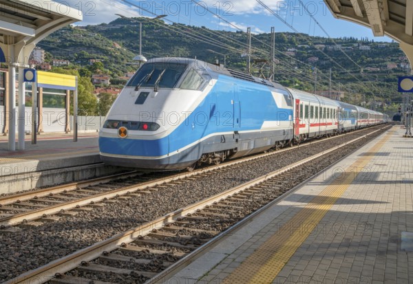Train at a railway station in Oneglia, a former town in northern Italy on the Ligurian coast, in 1923 joined to Porto Maurizio to form the Comune of Imperia