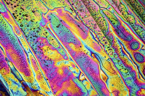 Colorful microscopic shot of Sodium acetate micro crystals in polarized light