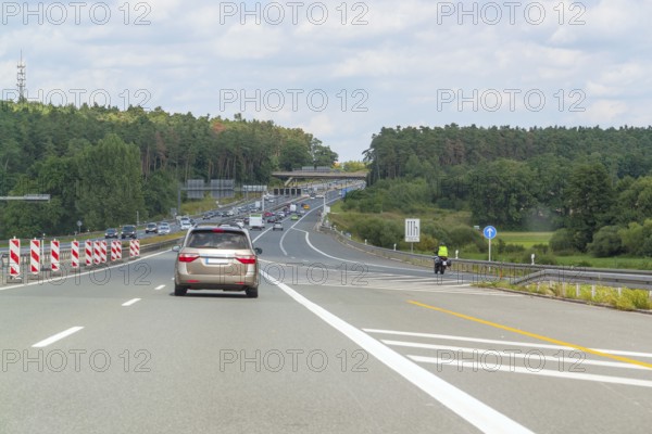 Scenery on a german motorway with road construction zone in sunny summer ambiance