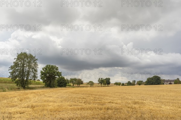Stormy farmland scenery in Hohenlohe, an area in Southern Germany at late summer time