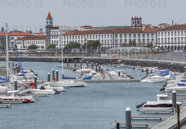 City view with harbor at Ponta Delgada, capital city of the Azores at Sao Miguel Island, the biggest island of the Azores Archipelago, wich is a group of vulcanic islands located in the middle of the North Atlantic Ocean Portugal